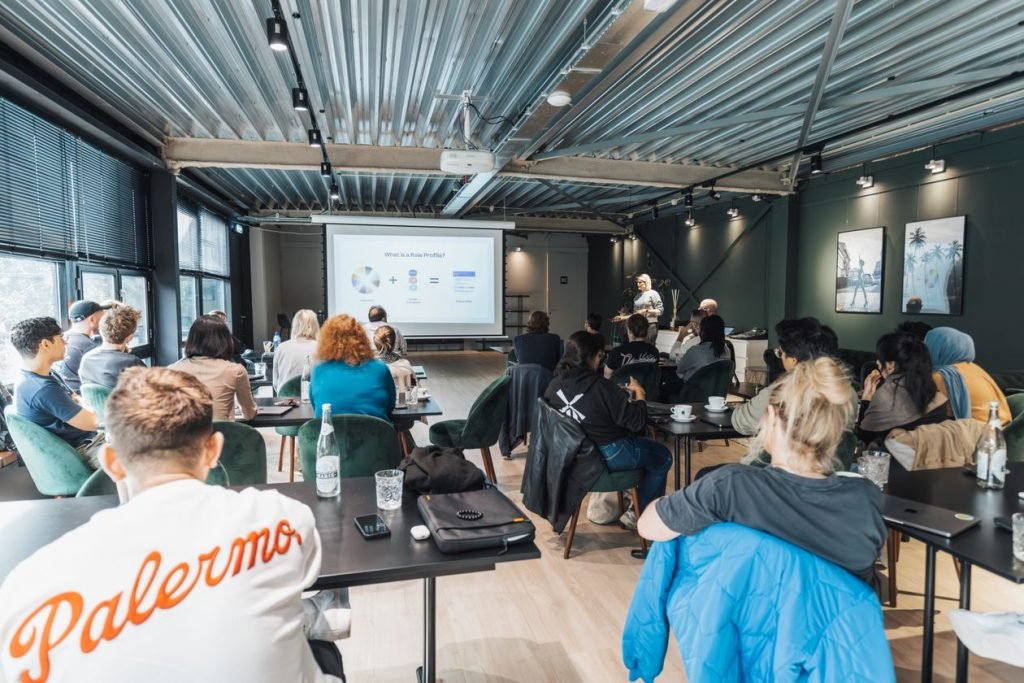 Group attending a corporate training workshop presentation