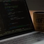 Laptop showing Python code for hands-on practice