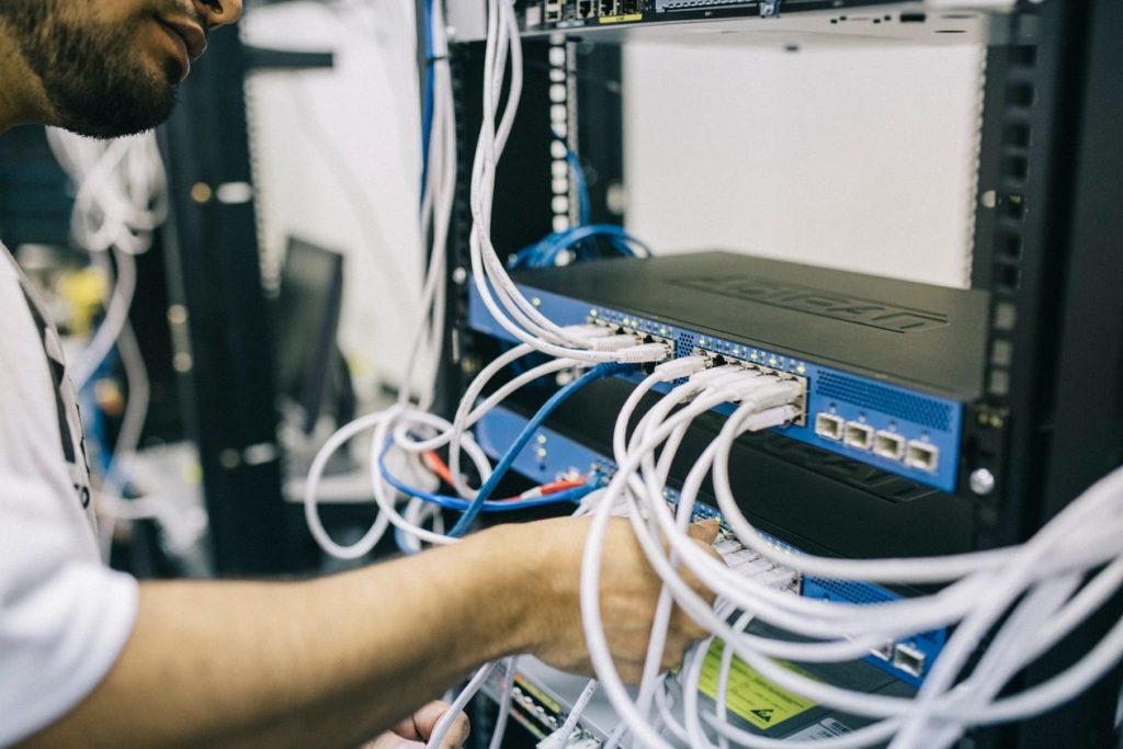 IT professional configuring server network cables