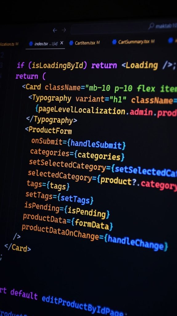 Colorful React JSX code displayed on a monitor