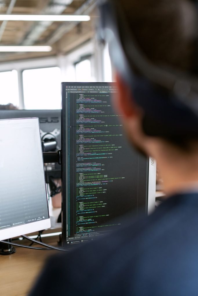 Software engineer working on code in a modern office