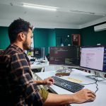 Developer building a React JS application in the office