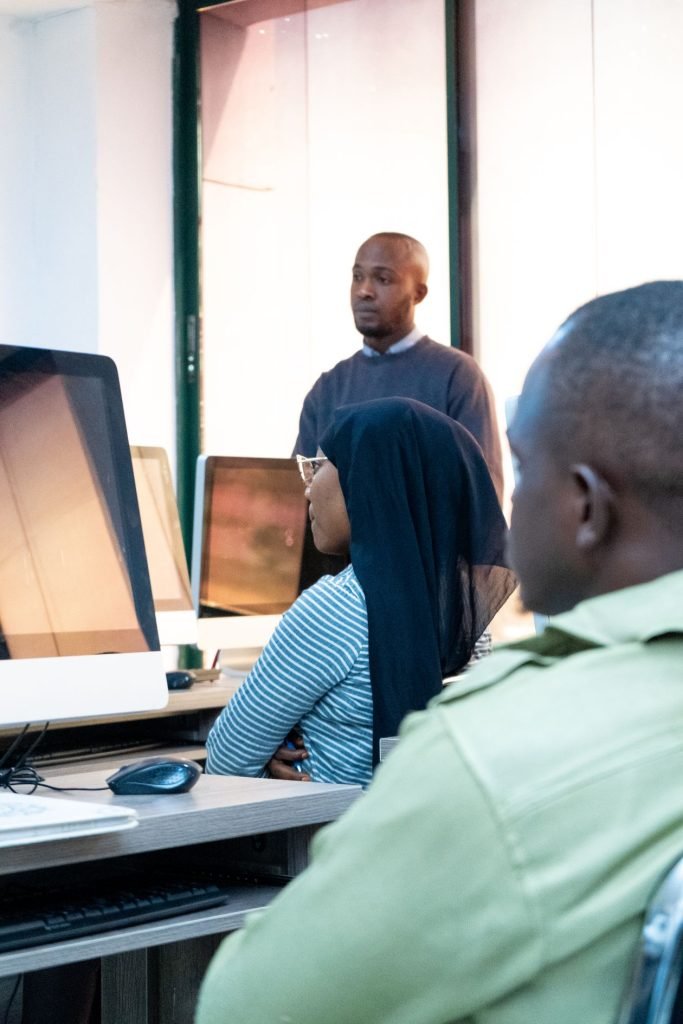 Group of students learning programming together in a lab